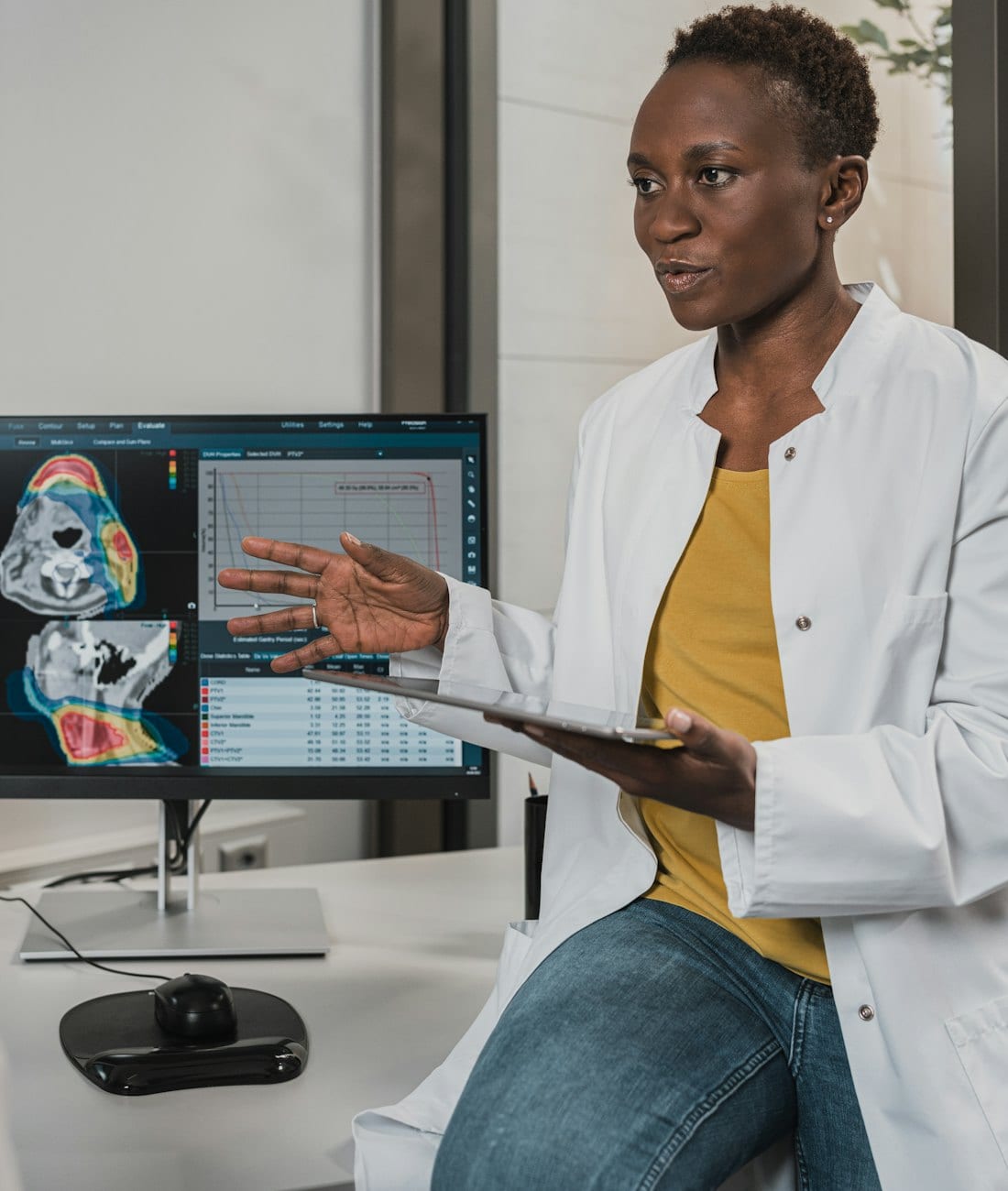 Two doctors reviewing a scan on a monitor